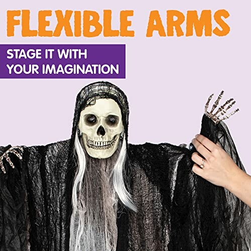 Skeleton decoration with flexible arms and black draped fabric.