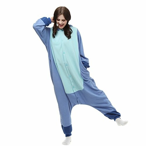 Woman wearing a blue onesie, posing playfully